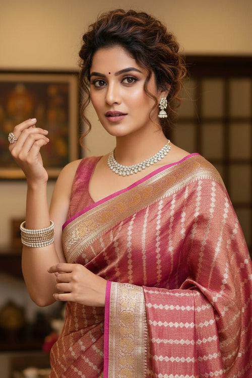 woman in a red striped saree indoors