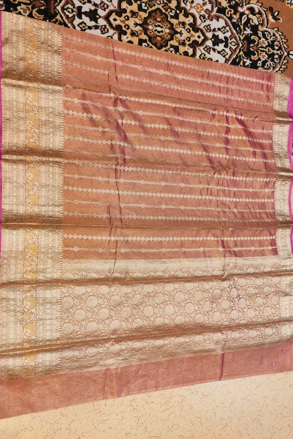 Traditional saree with a patterned background