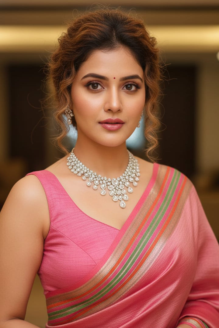woman in pink saree with jewellery