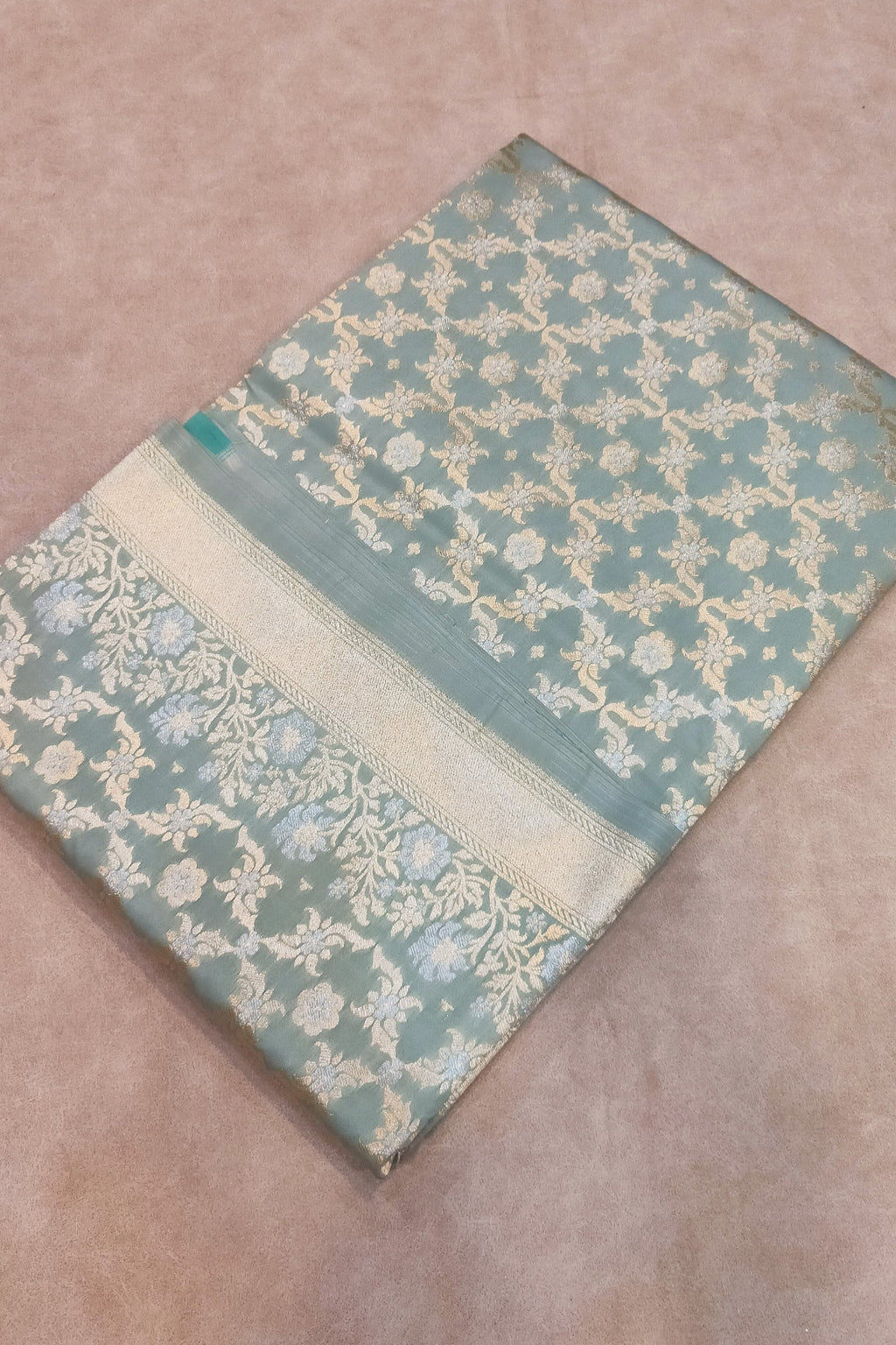 Decorative fabric with a floral pattern on a beige surface