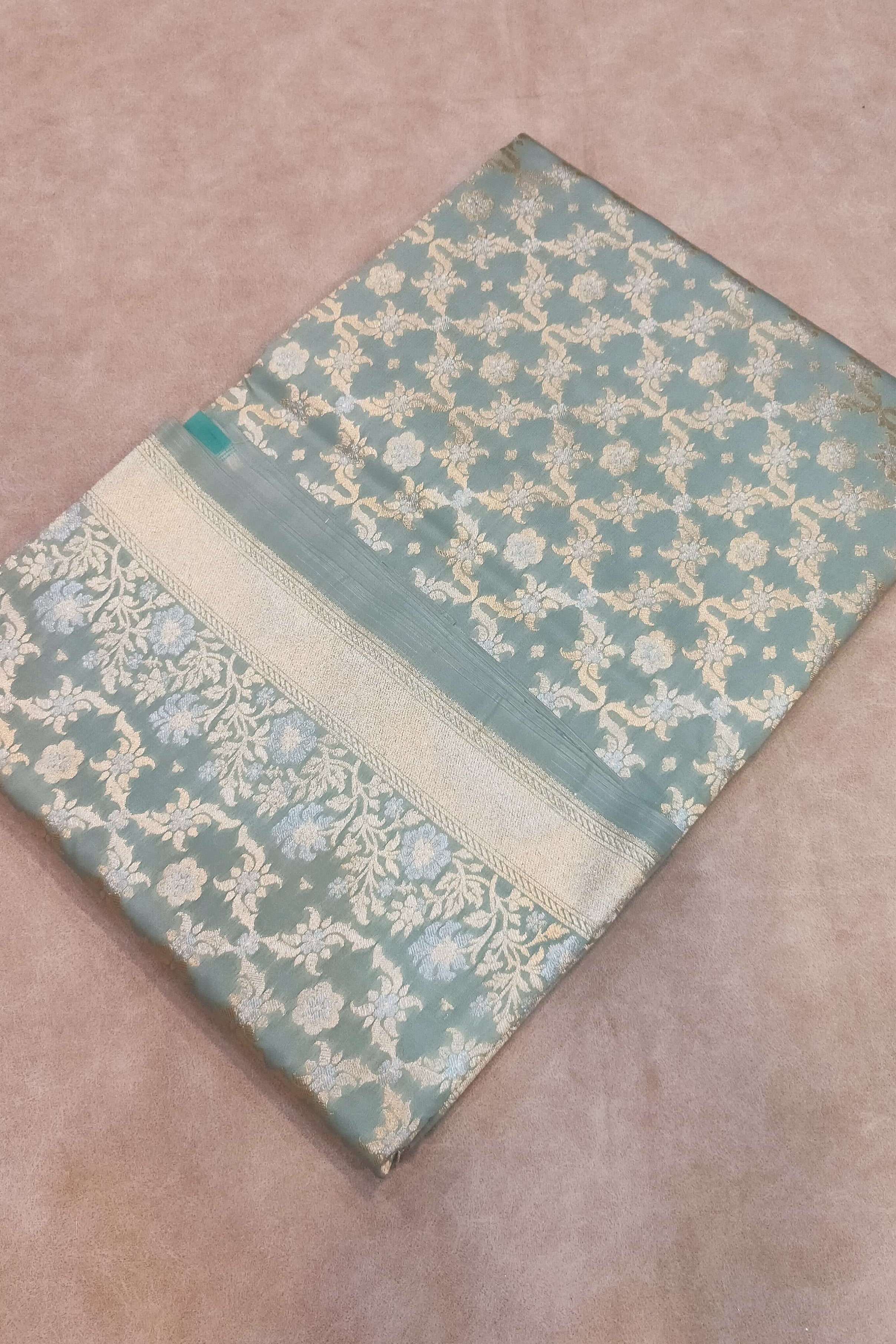 Decorative fabric with a floral pattern on a beige surface