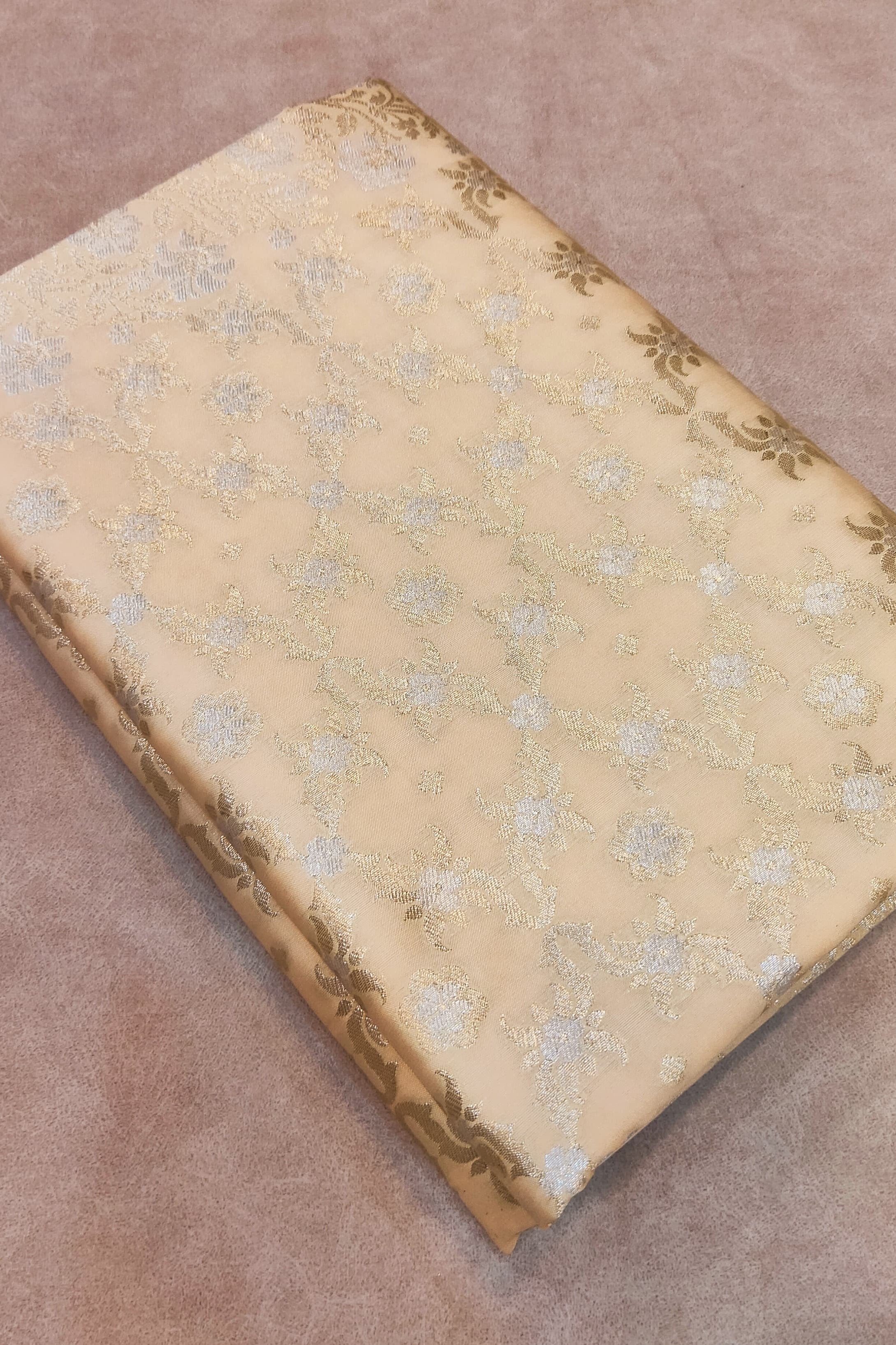 Decorative book with floral pattern on a brown surface