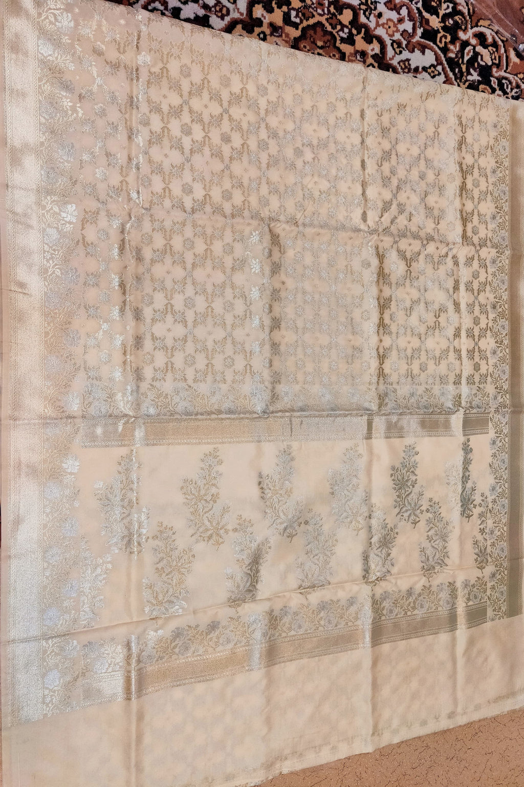 Beige fabric with floral patterns on a textured surface