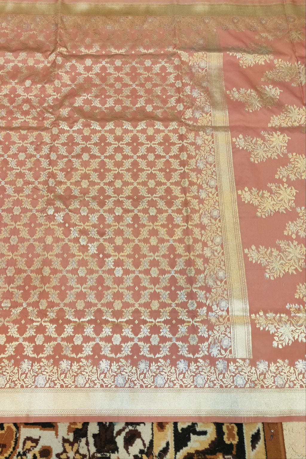 Pink and white patterned fabric on a wooden surface