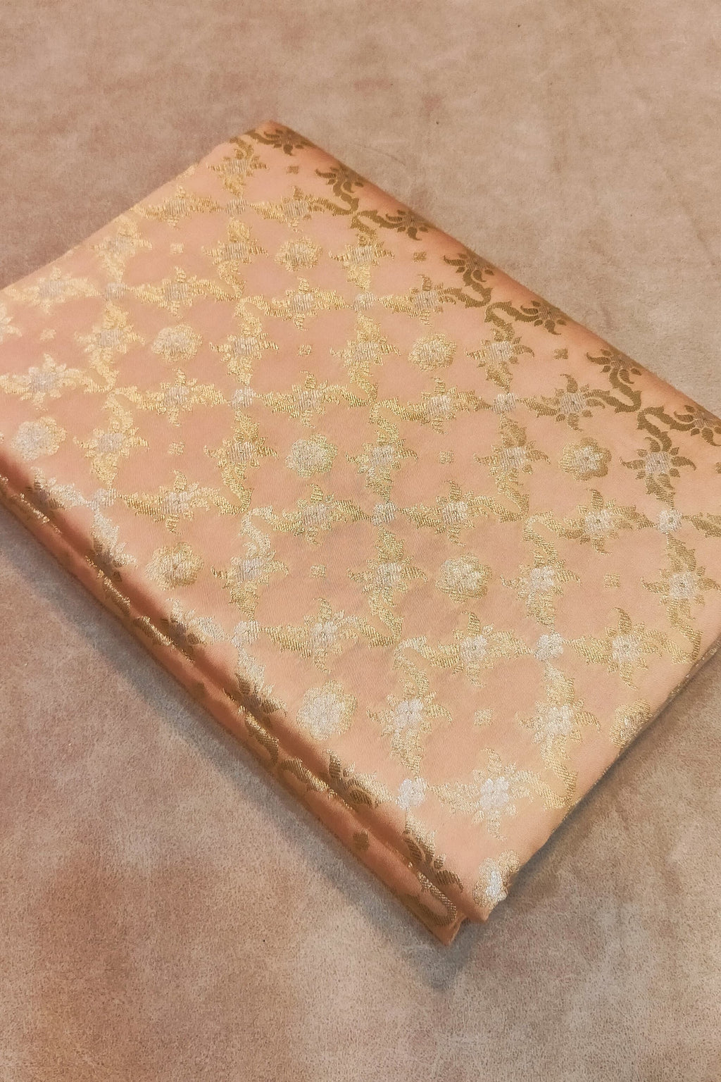 Vintage book with floral pattern on a beige surface