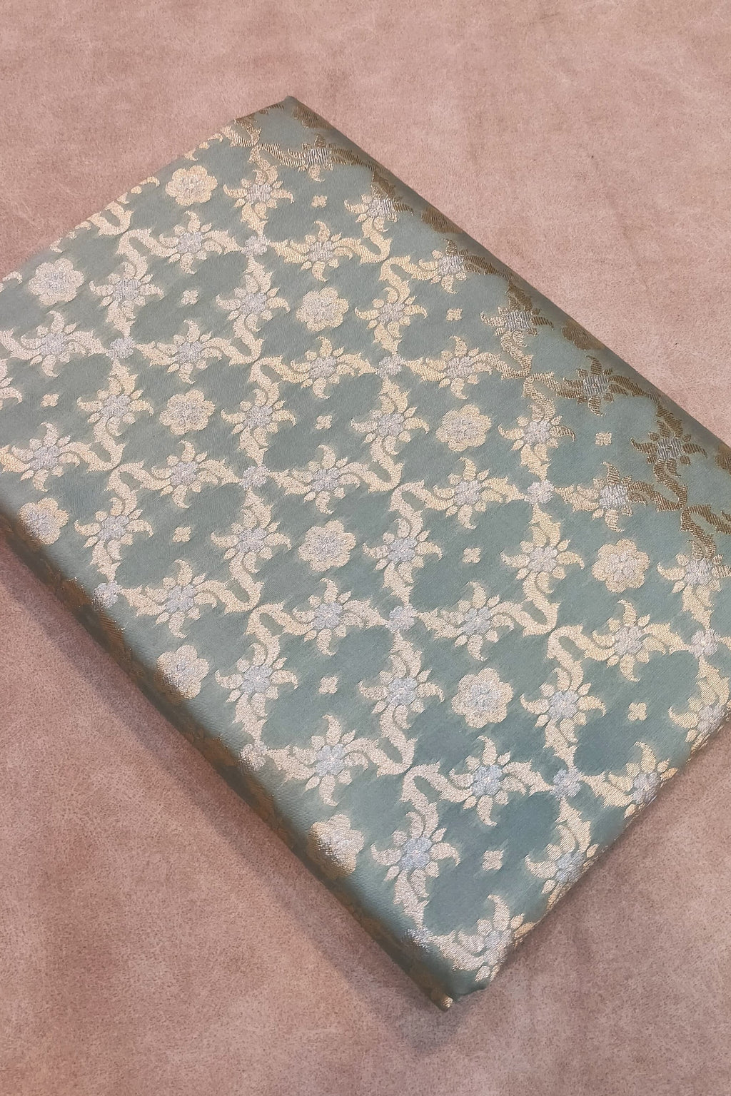 Decorative box with floral pattern on a textured surface