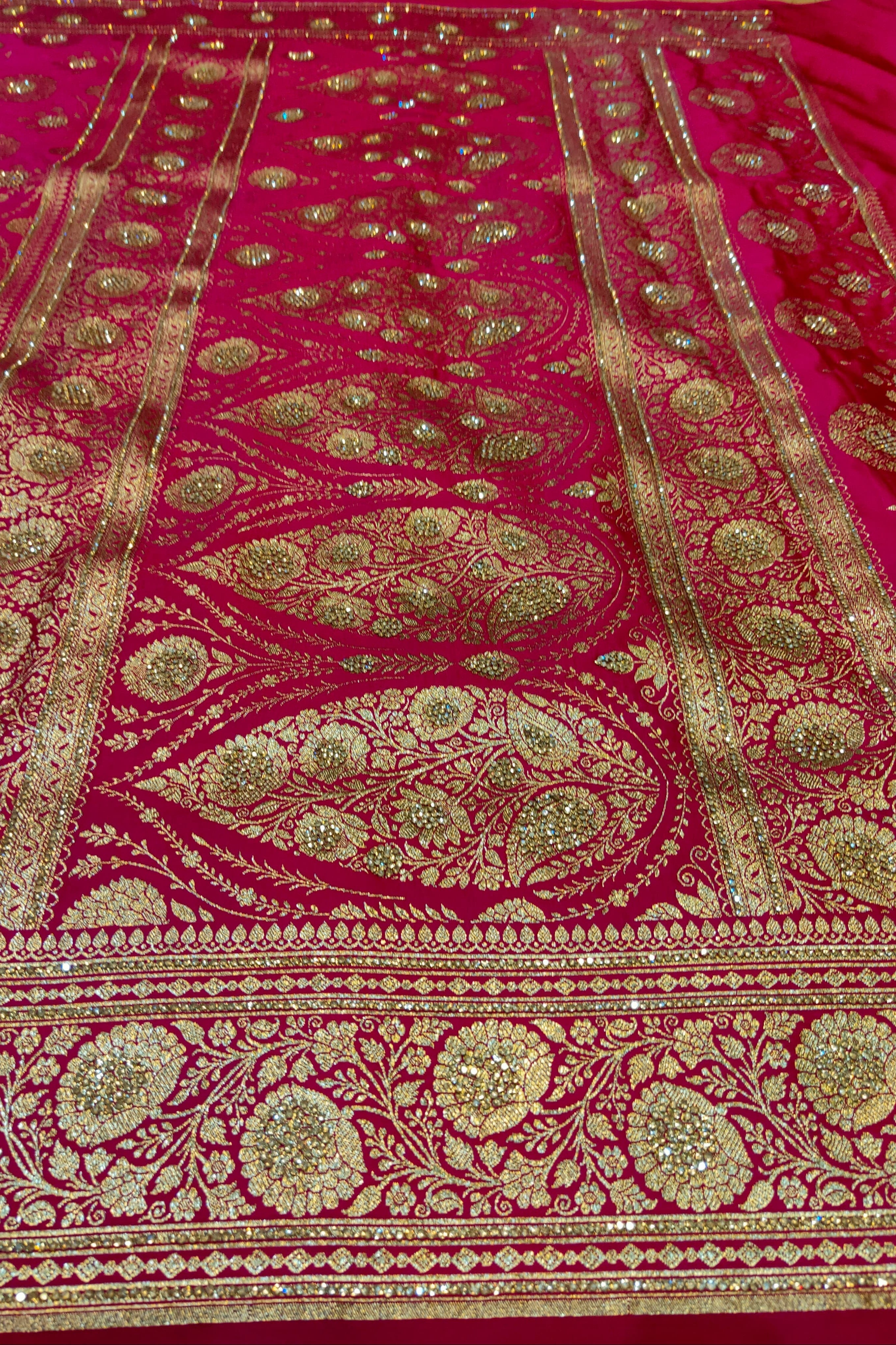 Pink fabric with intricate gold embroidery