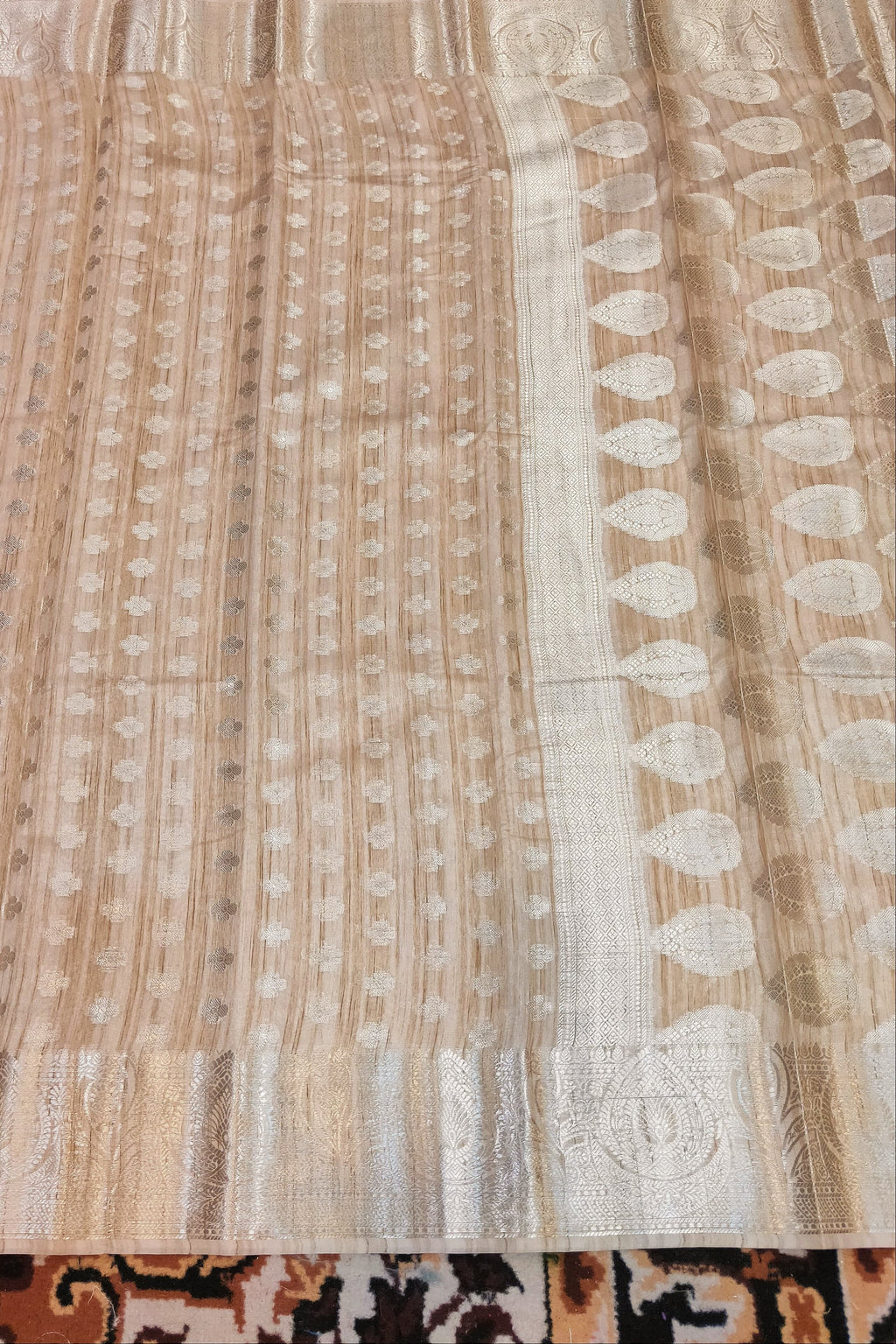 Textured fabric with a pattern on a carpeted floor